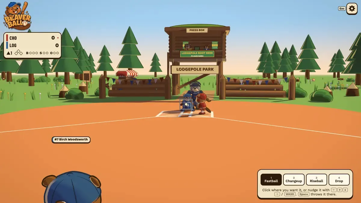 A beaver pitcher sets on the mound in front of the log press box at Lodgepole Park while the pitch picker shows fastball, changeup, riseball and drop.