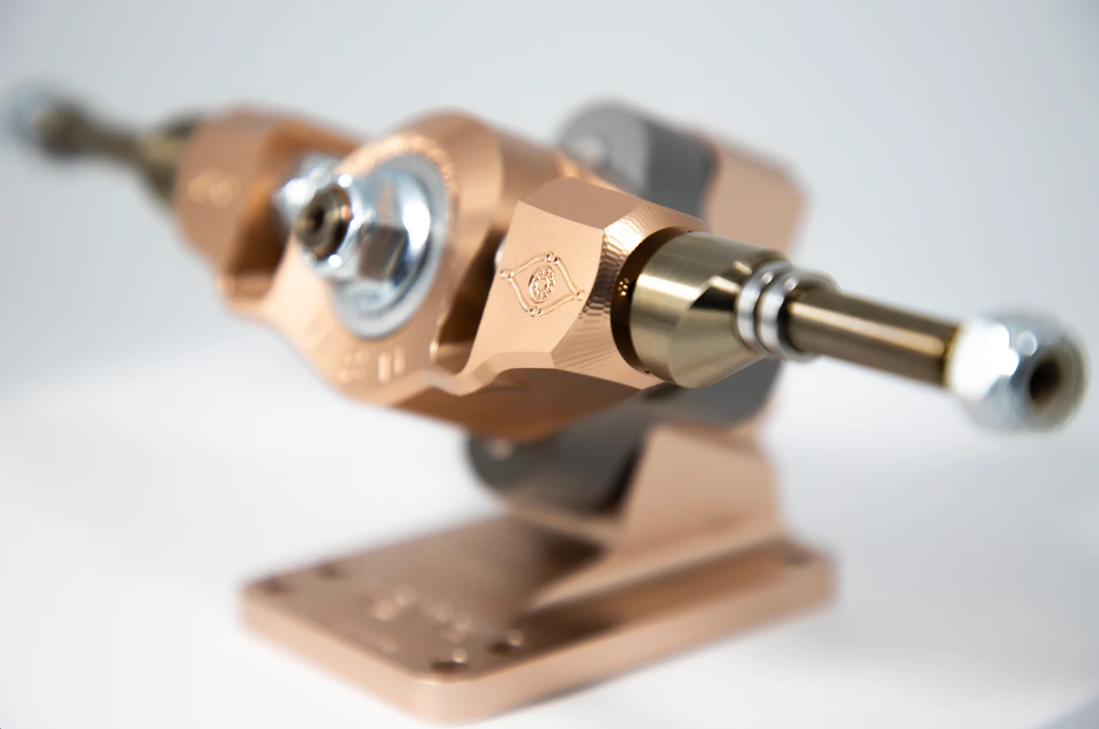 Close-up photograph by Waldo of a complete bronze Rojas Revolver skateboard truck